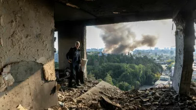 A friend of the owner inspects the damage in an apartment that was hit during a Russian drone strike, amid Russia's attack on Ukraine, in Kyiv, Ukraine September 7, 2025. REUTERS/Thomas Peter    TPX IMAGES OF THE DAY