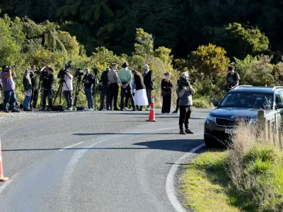 Members of the media stand on the side of a road where a police shootout occurred near the town of Piopio, located in New Zealand's Waikato region on September 8, 2025. A New Zealand father who spent nearly four years on the run with his children was killed in a police shootout on September 8, authorities said. Tom Phillips, who absconded with his three children in December 2021 after a row with his former partner, died in the rolling hill country of the North Island's Waikato region.,Image: 1035208608, License: Rights-managed, Restrictions:, Model Release: no