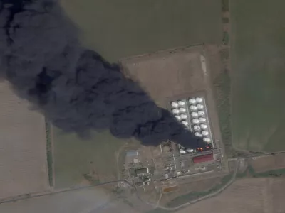 A satellite image shows smoke and fire rising from an oil depot, amid the ongoing conflict between Russia and Ukraine, at Astakhov in the Kamensky district, Rostov Region, Russia, August 28, 2024. 2024 Planet Labs Inc./Handout via REUTERS THIS IMAGE HAS BEEN SUPPLIED BY A THIRD PARTY. MANDATORY CREDIT.