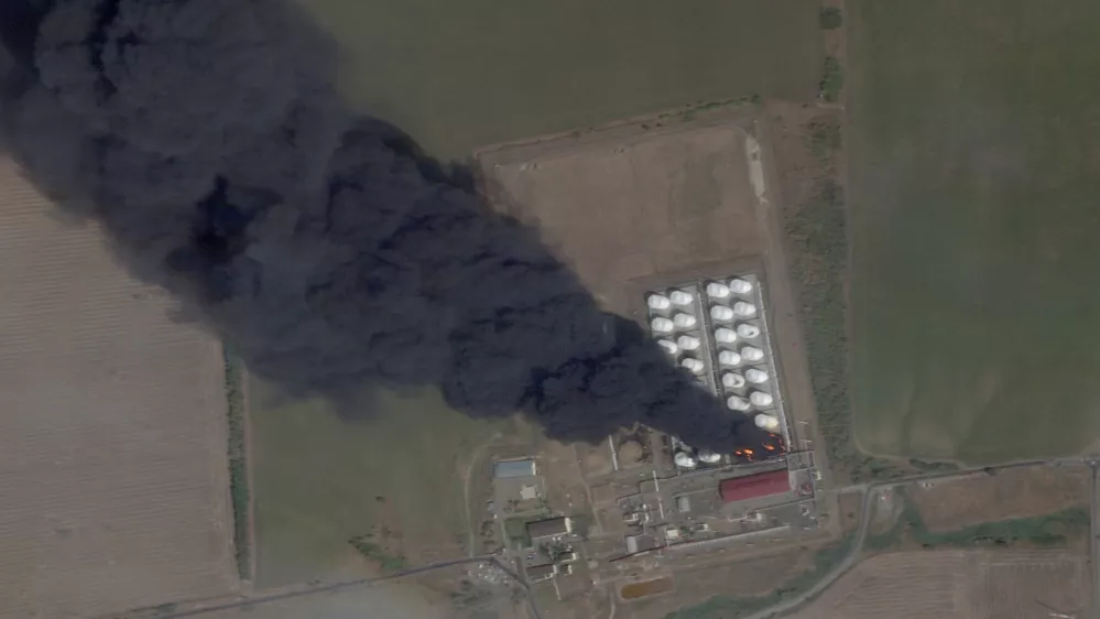 A satellite image shows smoke and fire rising from an oil depot, amid the ongoing conflict between Russia and Ukraine, at Astakhov in the Kamensky district, Rostov Region, Russia, August 28, 2024. 2024 Planet Labs Inc./Handout via REUTERS THIS IMAGE HAS BEEN SUPPLIED BY A THIRD PARTY. MANDATORY CREDIT.