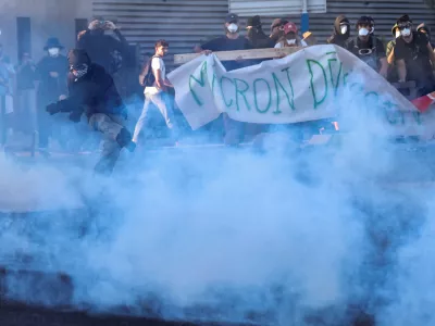 A demonstrator kicks away a tear gas canister as people gather to block traffic at a roundabout at Pres d'Arenes in Montpellier, as part of a grassroots protest movement called "Bloquons Tout" ("Let's Block Everything") calling for nationwide all-day disruption, France, September 10, 2025. REUTERS/Manon Cruz
