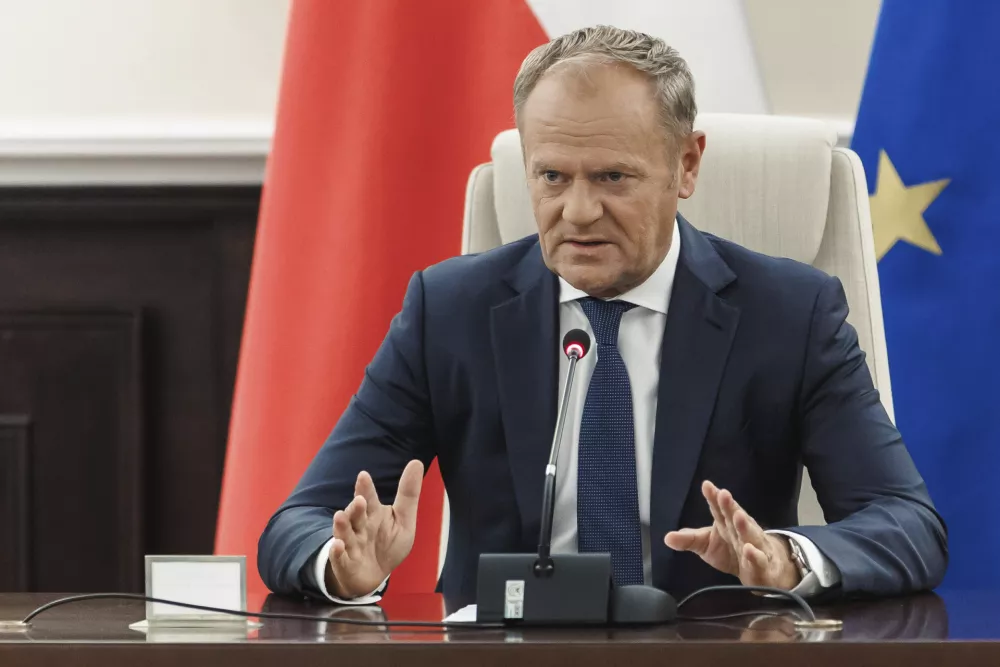 Polish Prime Minister Donald Tusk holds an extraordinary government meeting at the chancellery, with military and emergency services officials, following violations of Polish airspace during a Russian attack in Warsaw, Poland, Wednesday, Sept. 10, 2025. (Chancellery of the Prime Minister of Poland via AP)