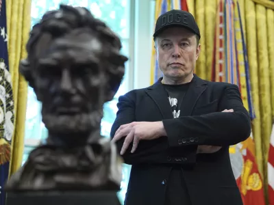 FILE - Elon Musk listens as President Donald Trump speaks during a news conference in the Oval Office of the White House, May 30, 2025, in Washington. (AP Photo/Evan Vucci, File)