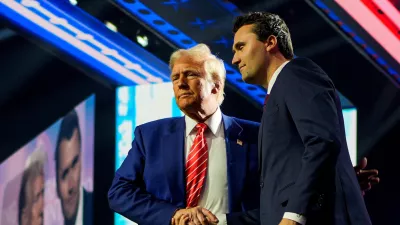 FILE PHOTO: U.S. President-elect Donald Trump shakes hands with Turning Point USA founder Charlie Kirk, at Turning Point USA's AmericaFest in Phoenix, Arizona, U.S., December 22, 2024. REUTERS/Cheney Orr/File Photo