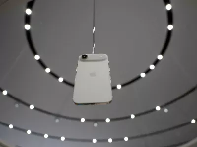 An iPhone Air hangs during an Apple's event at the Steve Jobs Theater on its campus in Cupertino, California, U.S. September 9, 2025. REUTERS/Manuel Orbegozo