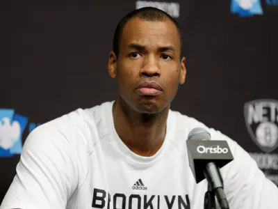 FILE - Brooklyn Nets Jason Collins speaks during a news conference before the NBA basketball game against the Chicago Bulls at the Barclays Center, Monday, March 3, 2014 in New York. (AP Photo/Seth Wenig, File)