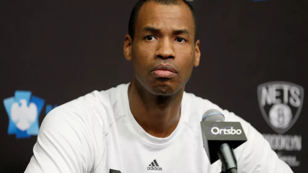 FILE - Brooklyn Nets Jason Collins speaks during a news conference before the NBA basketball game against the Chicago Bulls at the Barclays Center, Monday, March 3, 2014 in New York. (AP Photo/Seth Wenig, File)