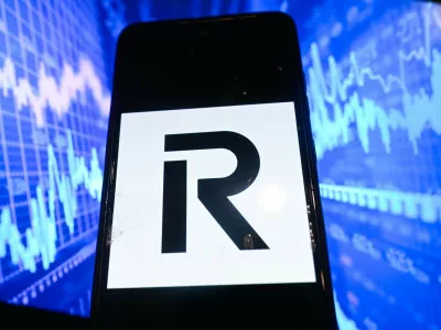 September 5, 2025, Poland: In this photo illustration, a Revolut logo is seen displayed on a smartphone with Stock market graphics on the background.,Image: 1034390709, License: Rights-managed, Restrictions:, Model Release: no