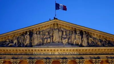 A French flag flutters on top of the National Assembly ahead of a confidence vote that the French Prime Minister Francois Bayrou seeks on the budget issue, in Paris, France, September 6, 2025. REUTERS/Abdul Saboor   TPX IMAGES OF THE DAY