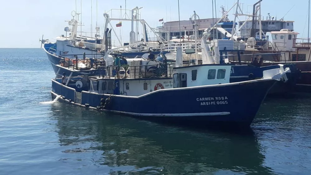 People stand aboard Venezuelan fishing vessel "Carmen Rosa", which, according to the Venezuelan government was allegedly intercepted by a U.S. warship in Caribbean waters on Friday, in this handout image taken at an unidentified location and released on September 13, 2025. Venezuela's Ministry of Communication and Information/Handout via REUTERS  THIS IMAGE HAS BEEN SUPPLIED BY A THIRD PARTY. MANDATORY CREDIT. NO RESALES. NO ARCHIVES. VENEZUELA OUT. NO COMMERCIAL OR EDITORIAL SALES IN VENEZUELA. VERIFICATION - Reuters was not able to independently verify the location and date.