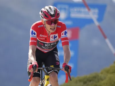 Danish cyclist Jonas Vingegaard completes the final meters before winning the 20th stage and his first overall victory in the Spanish cycling race La Vuelta, from Robledo de Chavela to Bola del Mundo, in Puerto de Navacerrada, Spain, on Saturday, September 13, 2025. (AP Photo/Manu Fern&aacute;ndez)