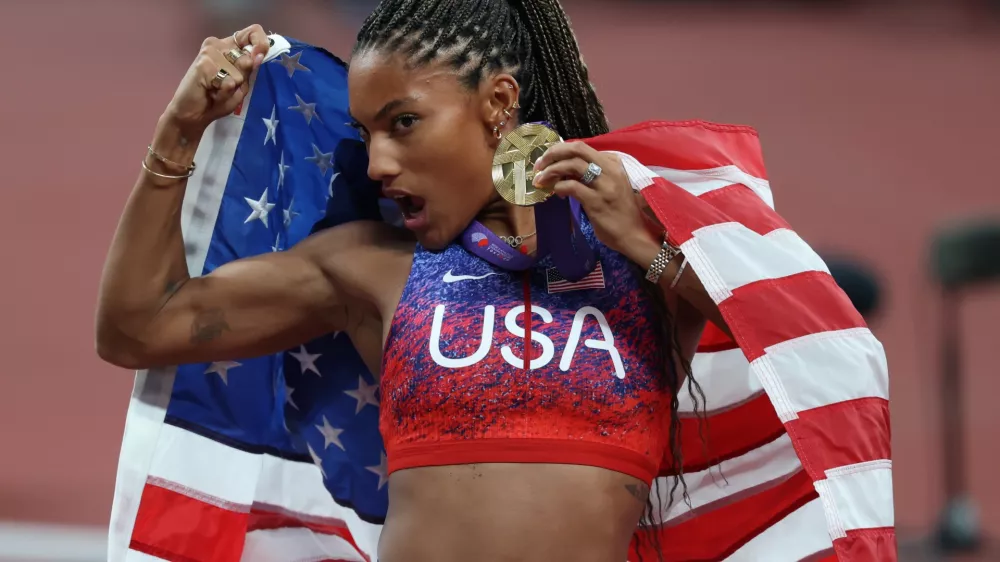 14 September 2025, Japan, Tokyo: USA's Tara Davis-Woodhall poses for a photo with her Gold Medal after winning the Woman's Long Jump Final on Day Two of the World Athletics Championships Tokyo 2025 at National Stadium. Photo: Oliver Weiken/dpa