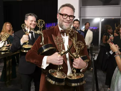 IMAGE DISTRIBUTED FOR THE TELEVISION ACADEMY &ndash; EXCLUSIVE - Seth Rogen picks up their official Emmy statuette at the 77th Emmy Awards Trophy Table on Sunday, Sept. 14, 2025 at the Peacock Theater in Los Angeles. (Photo by Mark Von Holden/Invision for the Television Academy/AP Content Services)