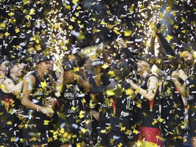 Germany players celebrate after winning the Eurobasket, European Basketball Championship final match between Turkey and Germany at the Riga Arena in Riga, Latvia, Sunday, Sept. 14, 2025. (AP Photo/Sergei Grits)