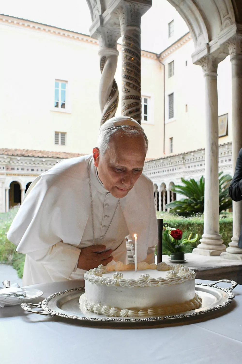 Pope Leo blows a candle as he marks his 70th birthday with with cardinals, Christian representatives and dignitaries after a commemoration for the Martyrs and Witnesses of Faith of the 21st century at the Basilica of St. Paul in Rome, Italy September 14, 2025. Vatican Media/&shy;Handout via REUTERS  ATTENTION EDITORS - THIS IMAGE WAS PROVIDED BY A THIRD PARTY.