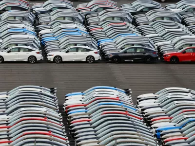 Honda vehicles are lined up at a vehicle storage yard at an industrial port, on the day U.S. President Donald Trump struck a trade deal with Japan that lowers tariffs on auto imports, in Yokohama, near Tokyo, Japan, July 23, 2025. REUTERS/Kim Kyung-Hoon