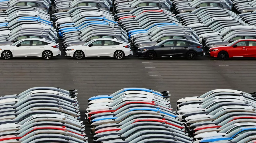 Honda vehicles are lined up at a vehicle storage yard at an industrial port, on the day U.S. President Donald Trump struck a trade deal with Japan that lowers tariffs on auto imports, in Yokohama, near Tokyo, Japan, July 23, 2025. REUTERS/Kim Kyung-Hoon