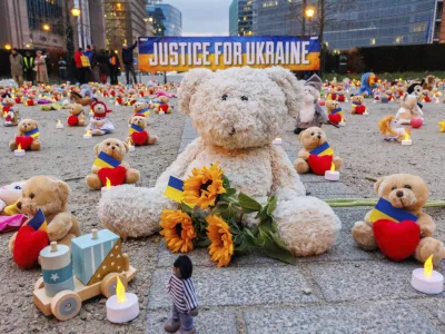 IMAGE DISTRIBUTED FOR AVAAZ.ORG - Avaaz members and Ukrainian refugees install thousands of kids' teddy bears and toys at Schuman Roundabout in front of the European Commission to highlight the reported abduction of thousands of Ukrainian children by Russia on Thursday Feb,23, 2022 in Brussels. Attendants call on EU, US, UK and Canadian leaders to sanction 14 Russian officials who are among those allegedly responsible for the abductions. (Olivier Matthys/AP Images for Avaaz.org)