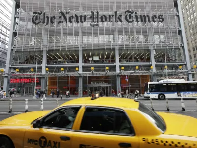 FILE - In this Tuesday, Oct. 18, 2011, file photo, traffic passes the New York Times building, in New York. The New York Times Co. reports financial earnings on Wednesday, May 3, 2017. (AP Photo/Mark Lennihan, File)