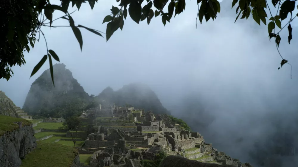 FILE PHOTO: Fog is seen around the Incan ruins of Machu Picchu, a tourism magnet, outside Cuzco, Peru, April 18, 2022. REUTERS/Alessandro Cinque/File Photo
