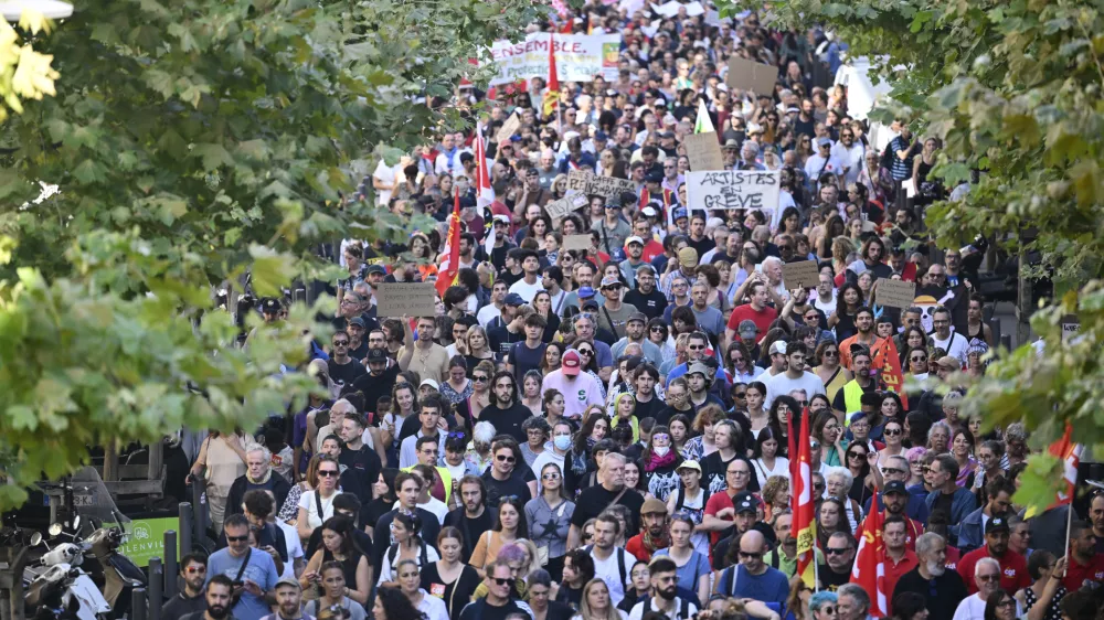 FILE- Protesters march during a rally of the "Block Everything" movement in Marseille, south of France, Wednesday, Sept. 10, 2025. (AP Photo/Philippe Magoni, File)
