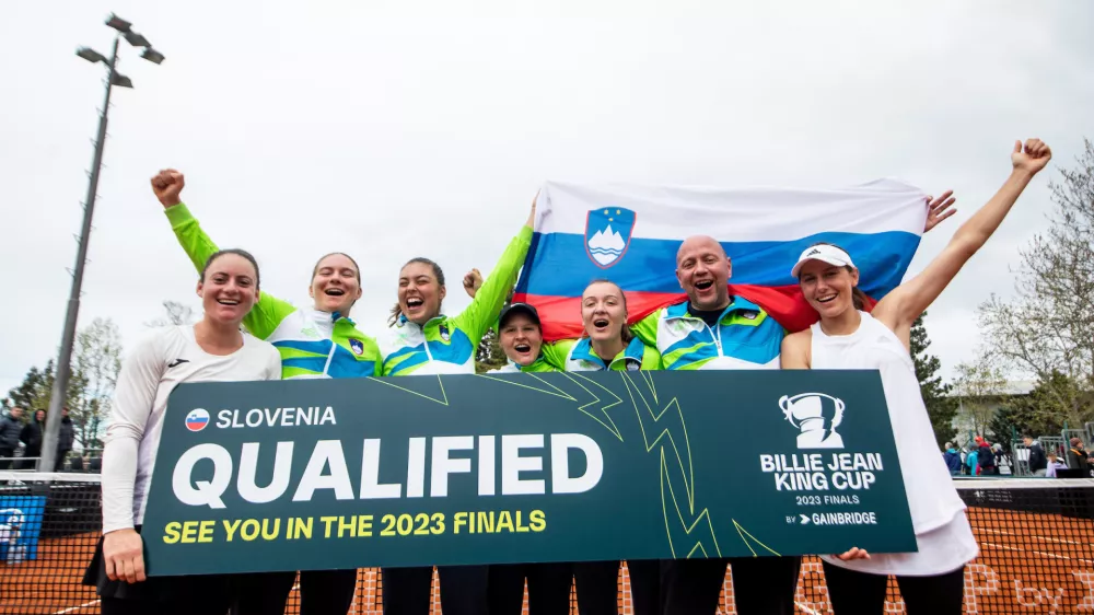 Tamara Zidansek, Ziva Falkner, Ela Nala Milic, Pia Lovric, Nina Potocnik, Andrej Krasevec and Kaja Juvan of Slovenia celebrate after winning during Match #5 at the 2023 Billie Jean King Cup by Gainbridge Qualifiers between Slovenia and Romania, on April 16, 2023 in Bonifika, Koper / Capodistria, Slovenia. Photo by Vid Ponikvar