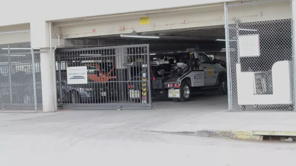 Hollywood towing yard where a rotting body found inside impounded Tesla registered to singer D4vd, Los Angeles police say.09 Sep 2025Pictured: d4vd impounded Tesla where body was found - Hollywood Tow.,Image: 1035583144, License: Rights-managed, Restrictions: World Rights, Model Release: no