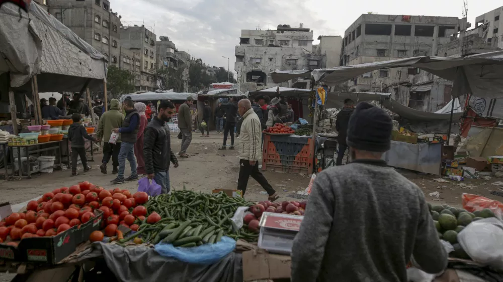 Palestinians shop at Sheikh Radwan Market, west of Gaza City, before the Iftar, the fast-breaking meal, during the holy month of Ramadan on Monday, March 3, 2025. (AP Photo/Jehad Alshrafi)