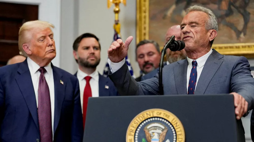 FILE PHOTO: U.S. Health and Human Services Secretary Robert F. Kennedy Jr. gestures as he delivers remarks next to U.S. President Donald Trump in the Roosevelt Room at the White House in Washington, D.C., U.S., July 31, 2025. REUTERS/Kent Nishimura/File Photo