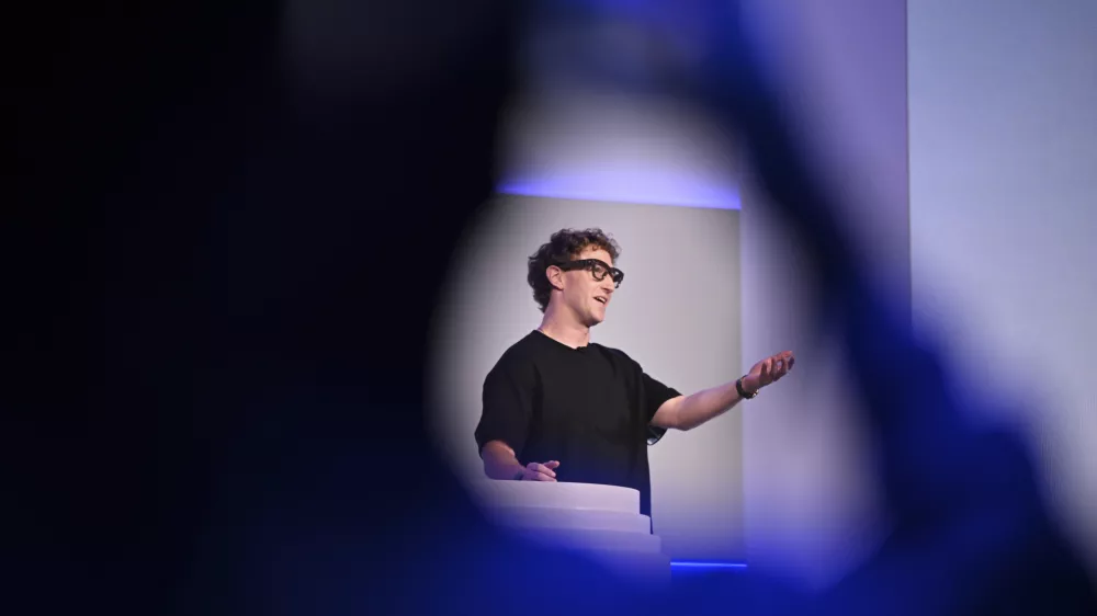 Meta CEO Mark Zuckerberg wears artificial intelligence-powered smart glasses as he speaks during the company's Connect developer conference Wednesday, Sept. 17, 2025, in Menlo Park, Calif. (AP Photo/Nic Coury)