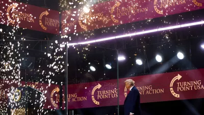 President Donald Trump walks on stage to speak at a memorial for conservative activist Charlie Kirk, Sunday, Sept. 21, 2025, at State Farm Stadium in Glendale, Ariz. (AP Photo/Julia Demaree Nikhinson)