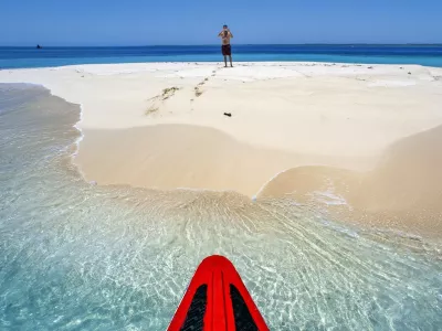 Tourists in a Isolated island uninhabited white sand beach, Ile-a-Vache, Sud Province, Haiti,Image: 1026785123, License: Rights-managed, Restrictions:, Model Release: no