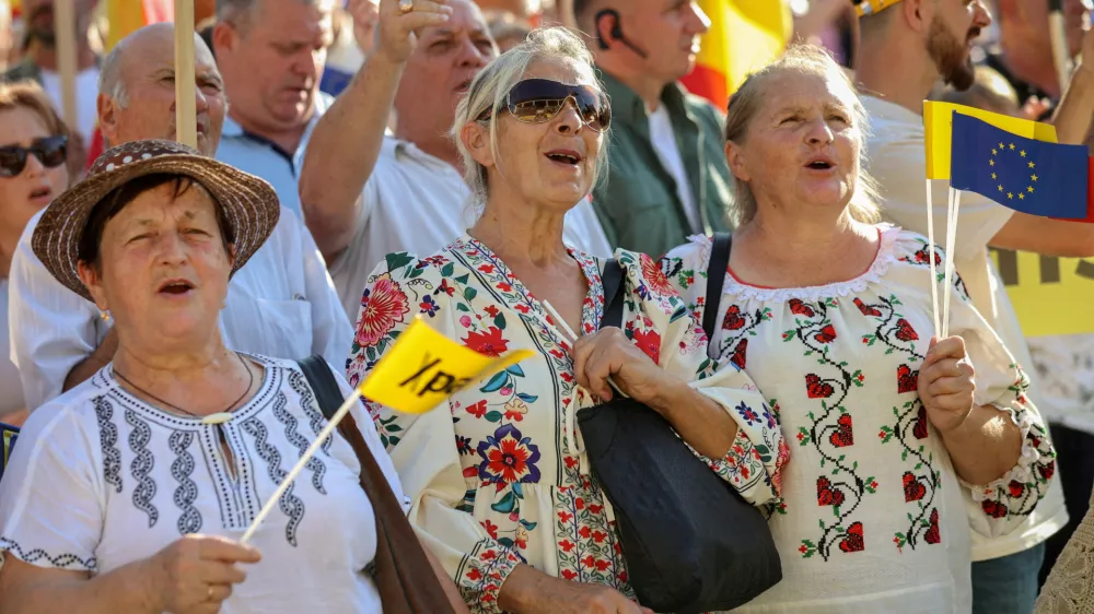 FILE PHOTO: People attend a rally launching the election campaign of the pro-European?Party?of Action and Solidarity (PAS) ahead of the parliamentary elections, in Chisinau, Moldova August 29, 2025. REUTERS/Vladislav Culiomza/File Photo