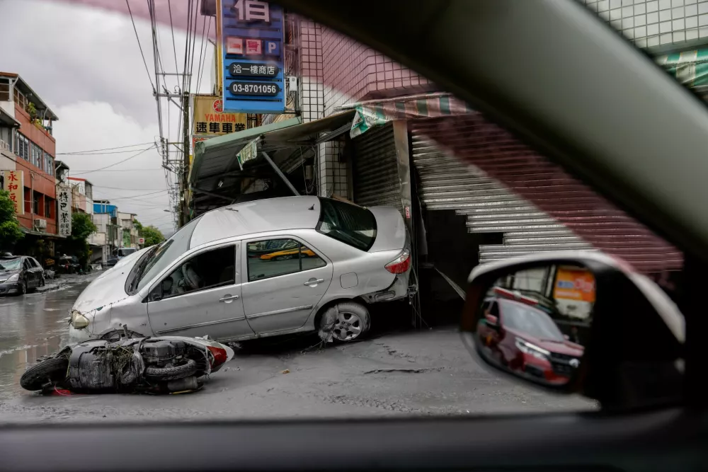 Damaged cars lie, following flooding brought by Super Typhoon Ragasa in Hualien, Taiwan, September 24, 2025. REUTERS/Ann Wang