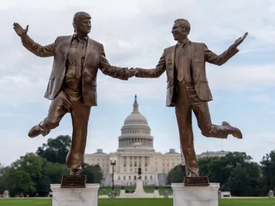 A work of protest art representing President Donald Trump and Jeffrey Epstein is seen on the National Mall near the Capitol, Tuesday, Sept. 23, 2025, in Washington. (AP Photo/Julia Demaree Nikhinson)