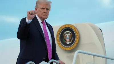 FILE PHOTO: U.S. President Donald Trump gestures as he boards Air Force One to depart for Washington, at Morristown Municipal Airport in Morristown, New Jersey, U.S., September 14, 2025. REUTERS/Ken Cedeno/File Photo