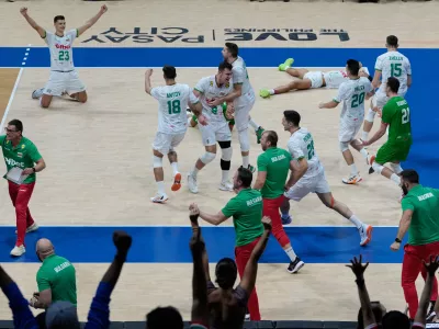 Team Bulgaria celebrates after defeating the United States in their quarterfinal match at the 2025 FIVB Volleyball Men's World Championship at the Mall of Asia Arena, Pasay city, Philippines on Thursday, Sept. 25, 2025. (AP Photo/Aaron Favila)