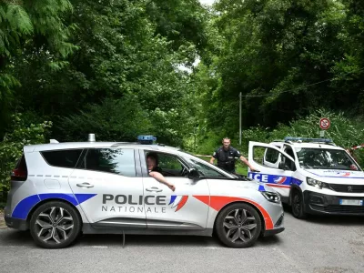 Police France, francija, policija, french police, francoska policijaPolice cars are parked in front of a cordoned-off area, near a sports field where a 32-year-old man was found dead with his throat slit and gutted, in Pont-de-Metz on August 4, 2025. The victim had stab wounds to the neck and back and has been found by a walker in a cross position, police told AFP.,Image: 1027676326, License: Rights-managed, Restrictions:, Model Release: no