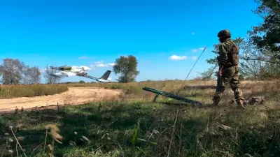 In this photo taken from video distributed by Russian Defense Ministry Press Service on Wednesday, Sept. 24, 2025, A Russian soldier launches a drone for an action in an undisclosed location in Ukraine. (Russian Defense Ministry Press Service via AP)