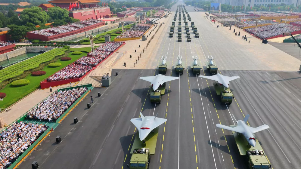 FILE - In this photo provided by China's Xinhua News Agency,In this photo released by Xinhua News Agency, drones and other armament formations pass during the military parade to commemorate the 80th anniversary of the end of World War II held in front of Tiananmen Gate in Beijing, Wednesday, Sept. 3, 2025. (Liu Xu/Xinhua via AP, File)