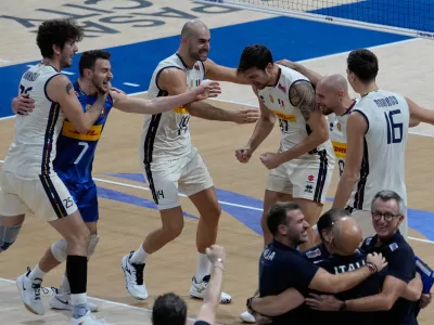 Team Italy celebrates after defeating Poland in their semifinal match at the 2025 FIVB Volleyball Men's World Championship in Pasay city, Philippines on Saturday, Sept. 27, 2025. (AP Photo/Aaron Favila)