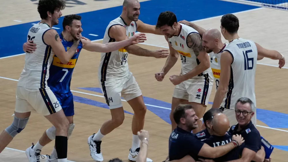 Team Italy celebrates after defeating Poland in their semifinal match at the 2025 FIVB Volleyball Men's World Championship in Pasay city, Philippines on Saturday, Sept. 27, 2025. (AP Photo/Aaron Favila)