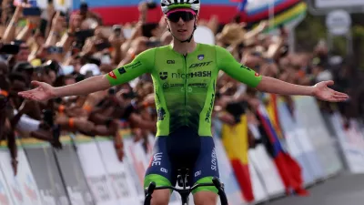 Cycling - Road World Championships 2025 - Kigali, Rwanda - September 28, 2025 Slovenia's Tadej Pogacar celebrates as he crosses the finish line to win the Men's Elite Road Race REUTERS/Jean Bizimana