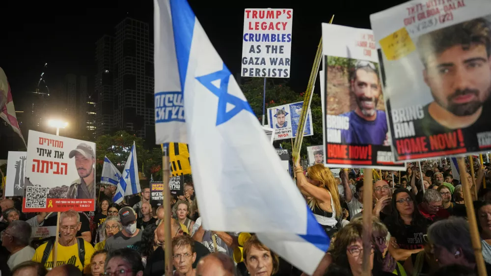 Relatives and supporters of Israeli hostages held in the Gaza Strip attend a rally demanding their release from Hamas captivity and calling for an end to the war, in Tel Aviv, Israel, Saturday, Sept. 27, 2025. (AP Photo/Ariel Schalit)