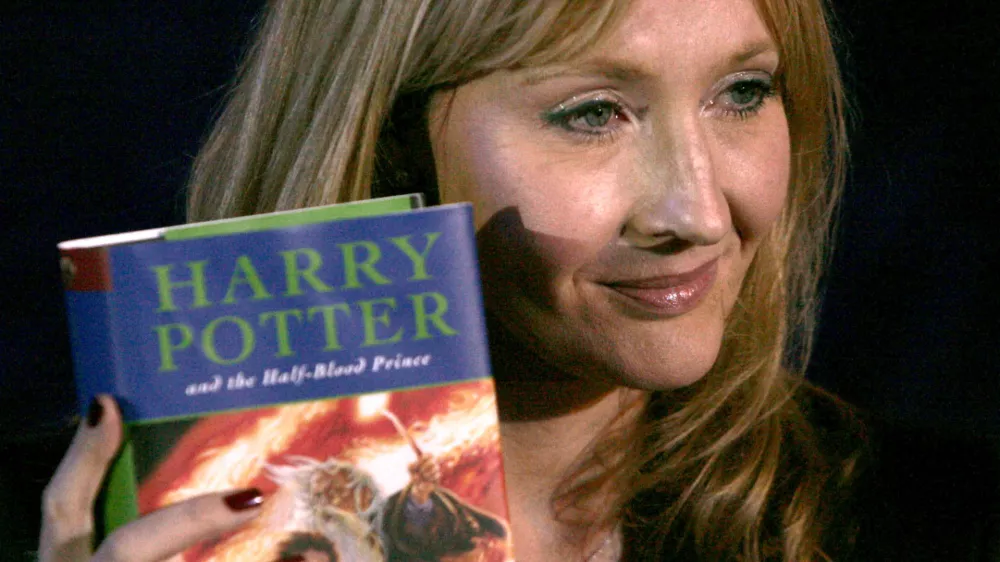 **FILE** British author J.K. Rowling holds a copy of her latest book, "Harry Potter and the Half-Blood Prince", in Edinburgh, Scotland,in a Friday, July 15, 2005 file photo. Rowling expects to have a busy 2006, the year,she says, that she will write the final book in the Harry Potter series. (AP Photo/Matt Dunham, File)