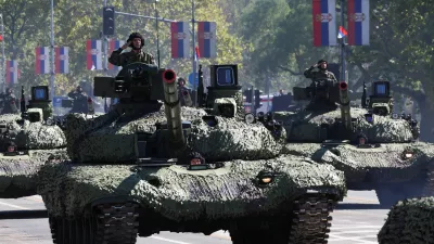 Serbian army soldiers ride on a military vehicles during a military parade in Belgrade, Serbia, September 20, 2025. REUTERS/Zorana Jevtic