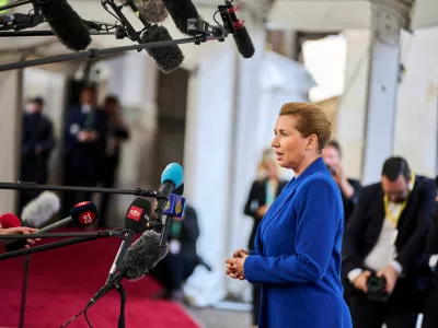 Denmark's Prime Minister Mette Frederiksen speaks to members of the media, during arrival for an informal summit at the Danish Parliament at Christiansborg Castle in Copenhagen, Denmark, October 1, 2025. Ritzau Scanpix/Thomas Traasdahl via REUTERS  ATTENTION EDITORS - THIS IMAGE WAS PROVIDED BY A THIRD PARTY. DENMARK OUT. NO COMMERCIAL OR EDITORIAL SALES IN DENMARK.