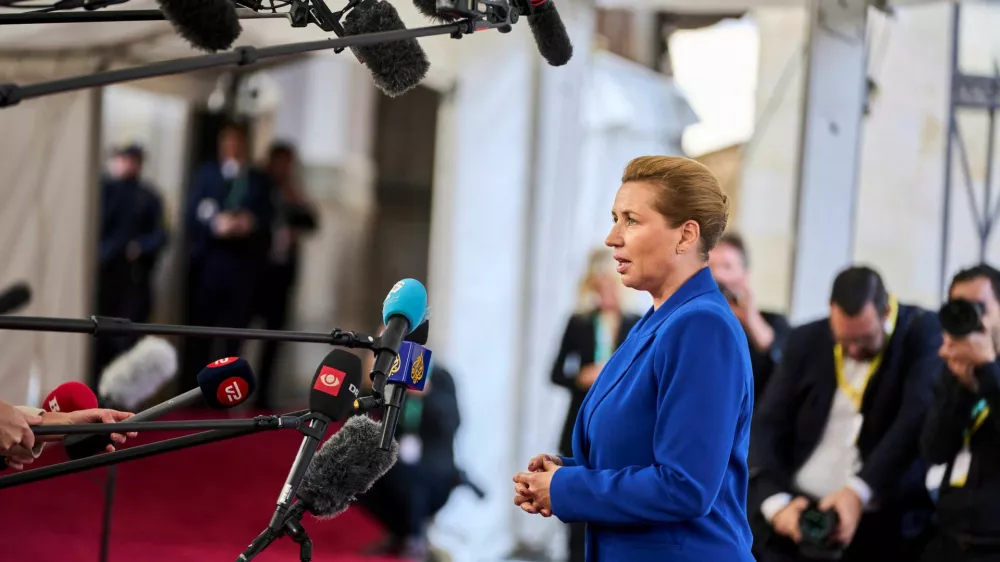 Denmark's Prime Minister Mette Frederiksen speaks to members of the media, during arrival for an informal summit at the Danish Parliament at Christiansborg Castle in Copenhagen, Denmark, October 1, 2025. Ritzau Scanpix/Thomas Traasdahl via REUTERS  ATTENTION EDITORS - THIS IMAGE WAS PROVIDED BY A THIRD PARTY. DENMARK OUT. NO COMMERCIAL OR EDITORIAL SALES IN DENMARK.