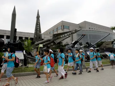 South Korean children walk by North Korean mock Scud-B missile, left, and other South Korean mock missiles at the Korea War Memorial Museum in Seoul, South Korea, Friday, June 19, 2009. The United States says it has deployed anti-missile defenses around Hawaii, following reports that North Korea is preparing to fire its most advanced ballistic missile in that direction to coincide with the U.S. Independence Day holiday next month. (AP Photo/ Lee Jin-man)