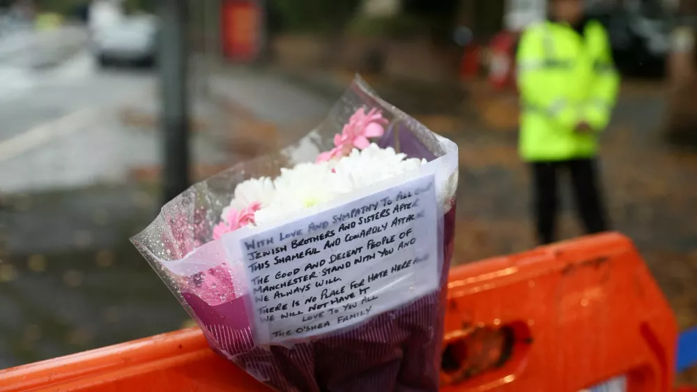 A floral tribute is left outside the Manchester synagogue, where multiple people were killed on Yom Kippur in what police have declared a terrorist incident, in north Manchester, Britain, October 3, 2025. REUTERS/Temilade Adelaja